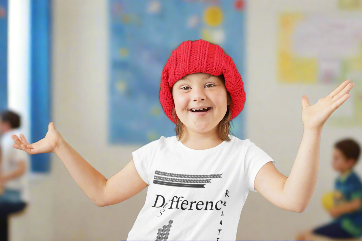 A girl with downsyndrome wearing a t-shirt with the text "Difference is Relative" in bold typography, promoting disability awareness and inclusivity.
